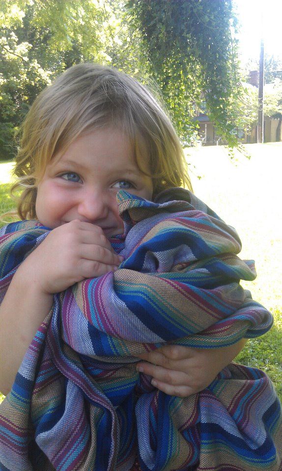 Toddler hugging Inka Storch wrap
