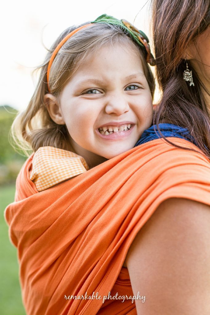 Annabelle, 3 years old, wrapped up in an Orange Miel et Malice wrap by C&C